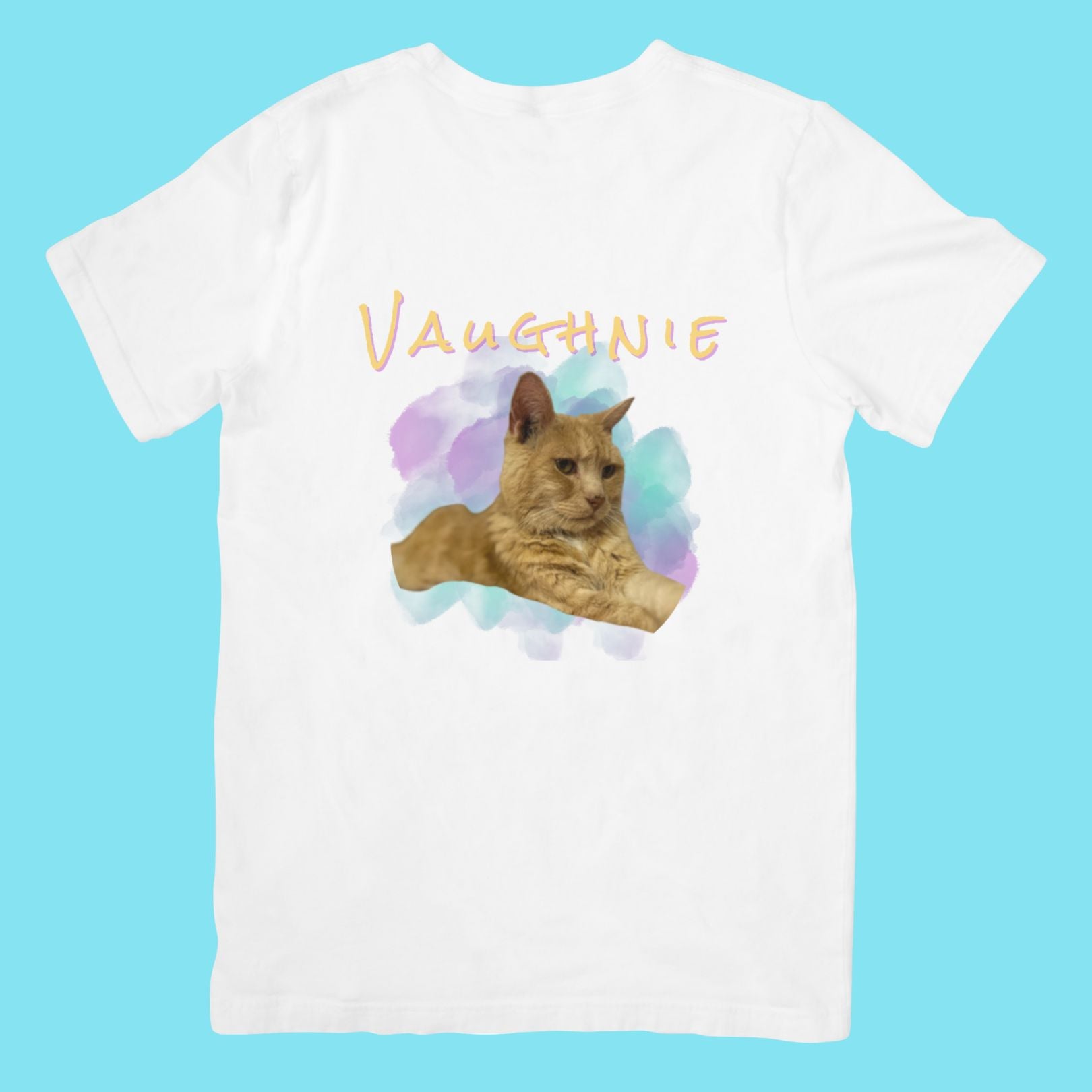 White t-shirt with a cat graphic and 'VAUGHNIE' text on a blue background